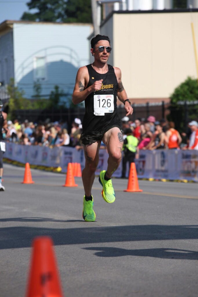 Ryan Carney racing on the road at the Saranac race